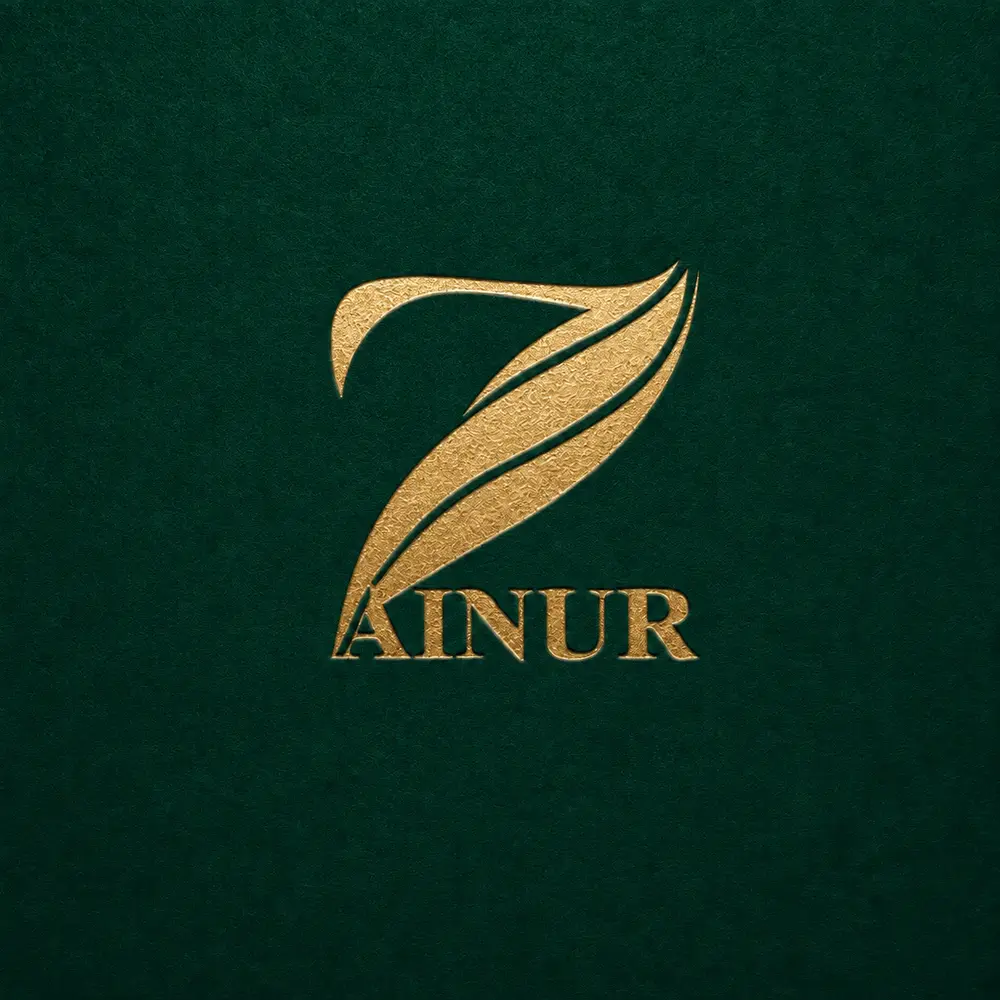Zainur gold logo embossed into a deep forest-green card